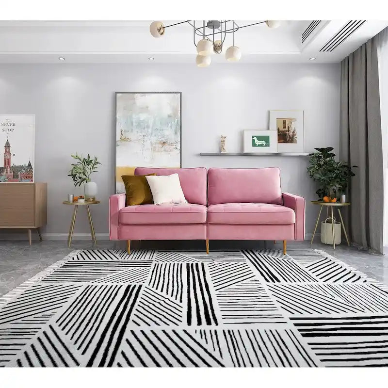 Canapé moderne en velours avec pieds en métal doré et coussins décoratifs