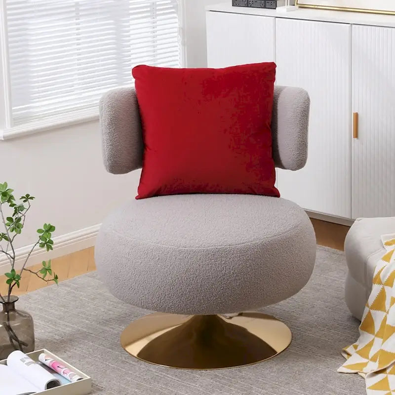 Fauteuil pivotant rembourré avec base en métal doré et dossier enveloppant