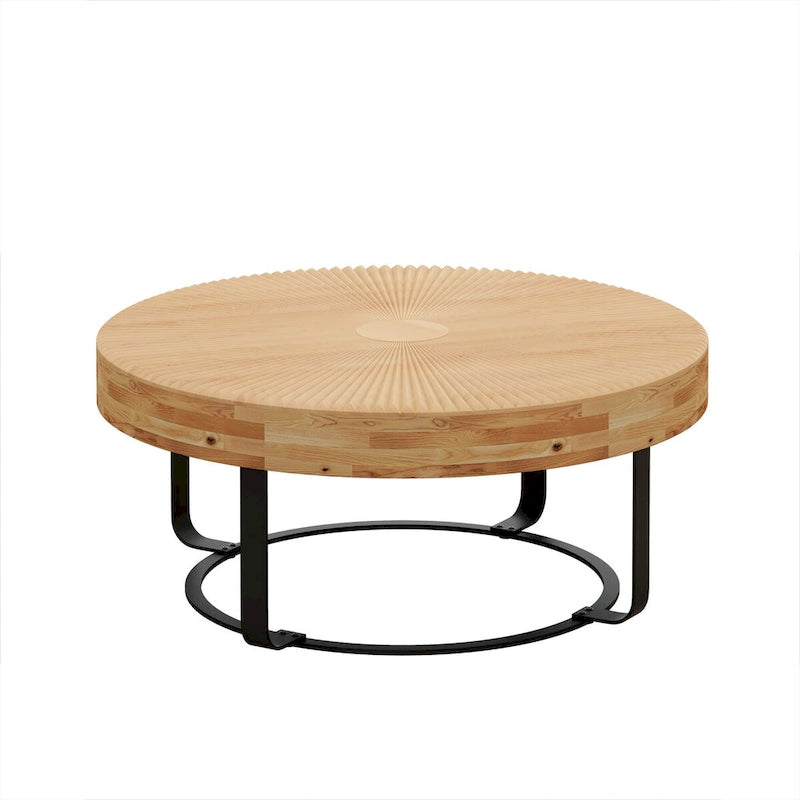 Table basse ronde en pin sculpté avec piètement en anneau en métal noir